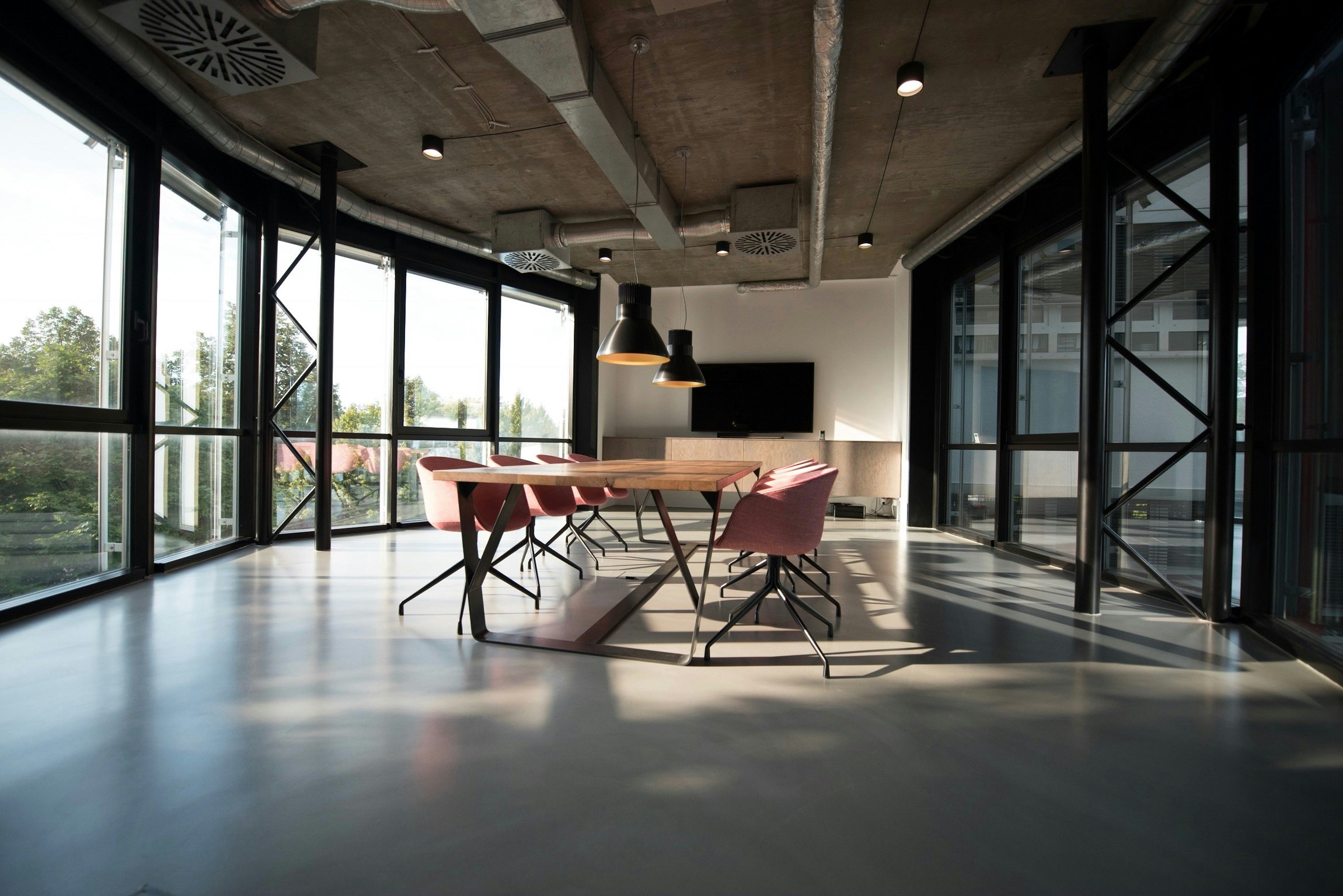 A sunlit boardroom prepared for work