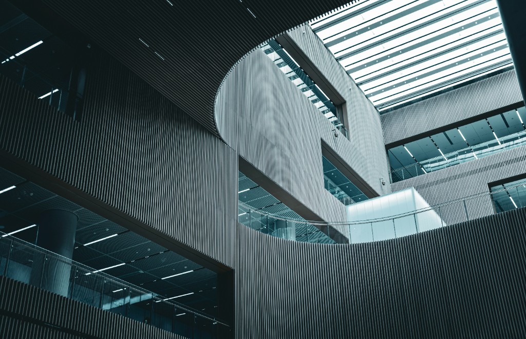 Structured modern building interior with curved slatted walls